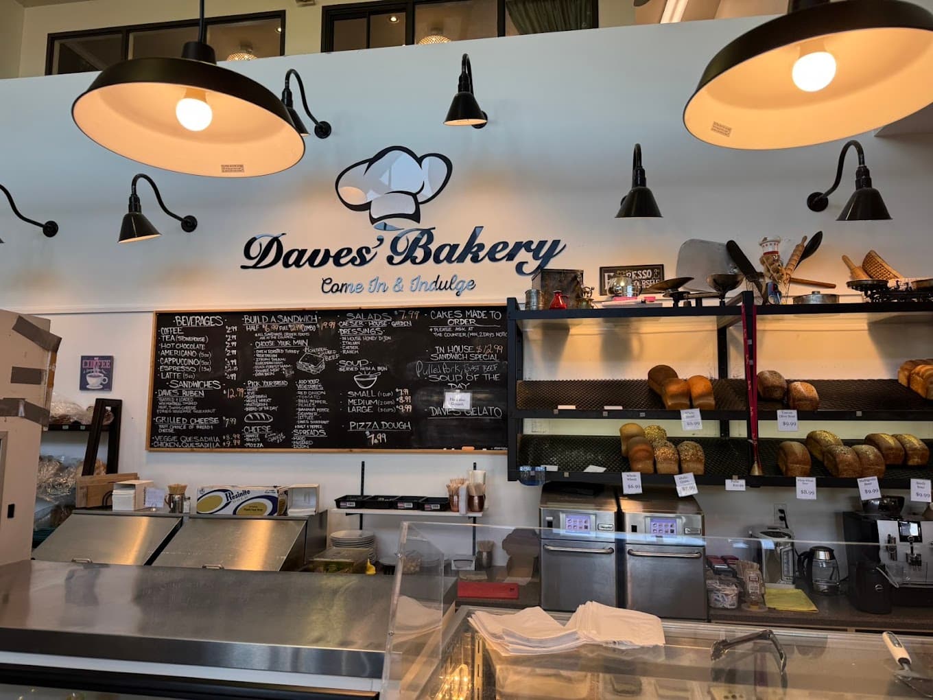 The chalkboard menus and bread racks behind the Daves' Bakery counter